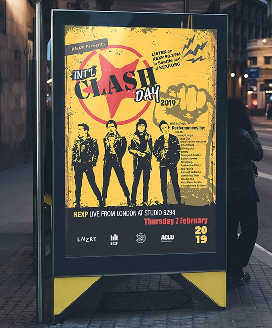 International Clash Day animated poster displayed on digital billboard showing yellow poster with band silhouettes and event information.